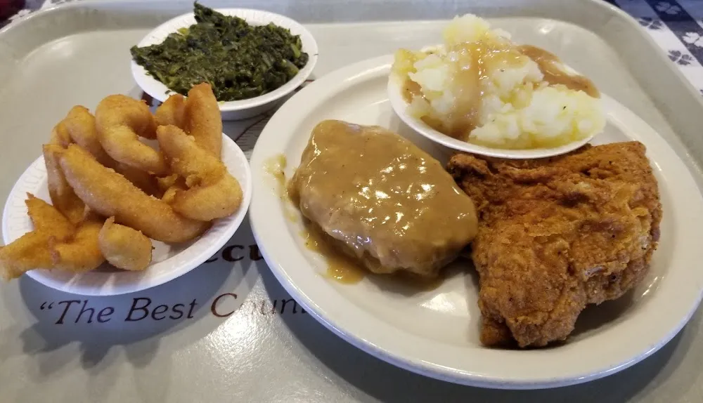 Country Style Steak Fried Chicken Potatoes and Gravy Turnips and Hush Puppies